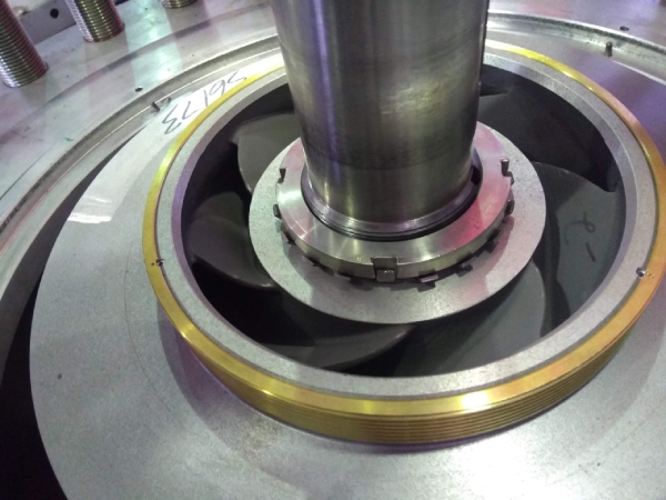 Close-up of an industrial pump impeller with shaft