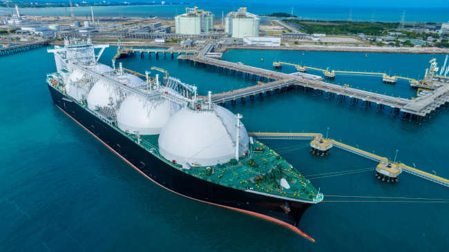 LNG carrier ship docked at a port terminal