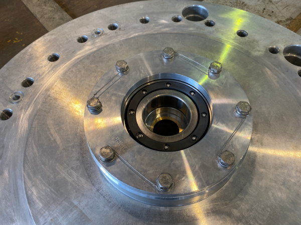 Safety-wired bolts on a metal bearing assembly